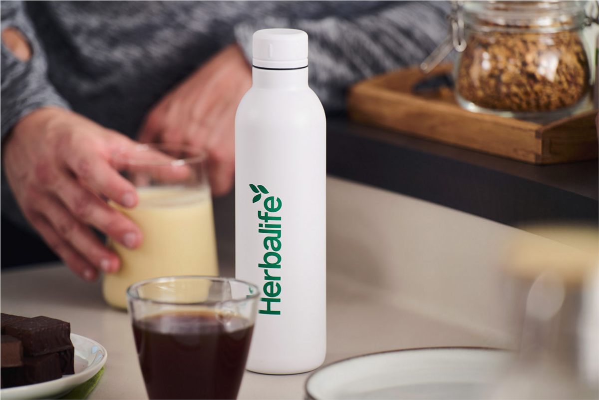 Herbalife product beside breakfast shakes and oats