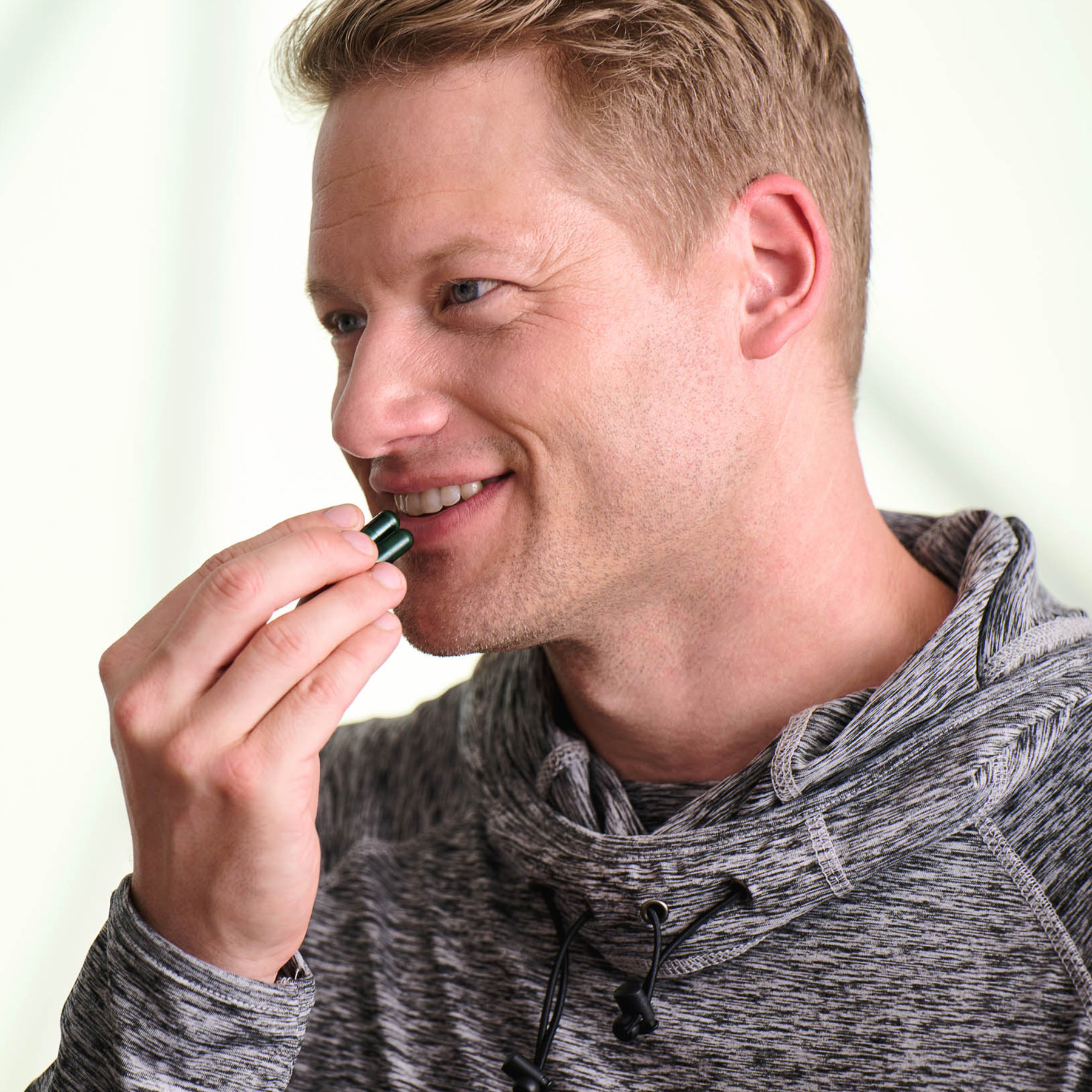 Happy man taking supplements